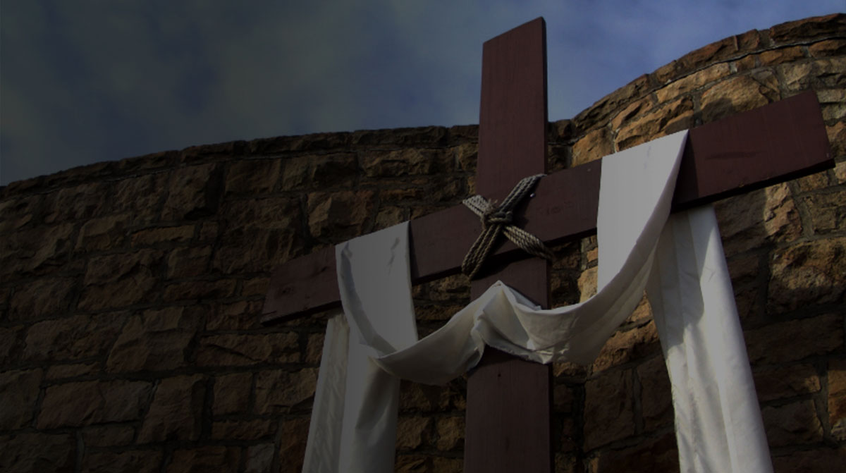 Wooden cross with white cloth draped across